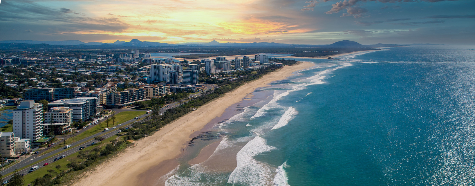 Breathtaking aerial view of the ocean and the city at the sunset in Queensland, Australia